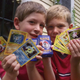 Tyler, right, and his friend George, both six of Scituate, Mass., hold up their favorite Pokemon trading cards, in Scituate, Thursday, Sept. 9, 1999.